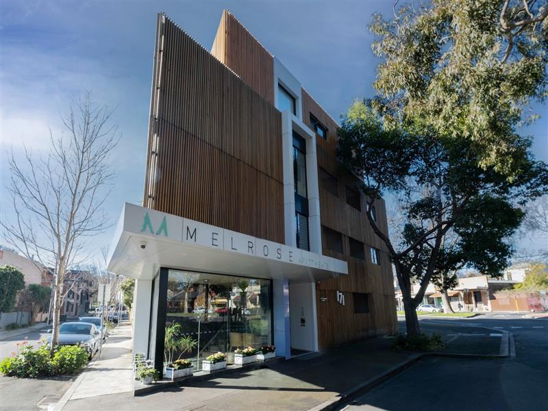 A photo of the front of an apartment building