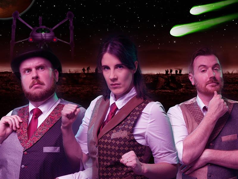 Dapperly dressed comedians standing ready to fight the Martian invasion.