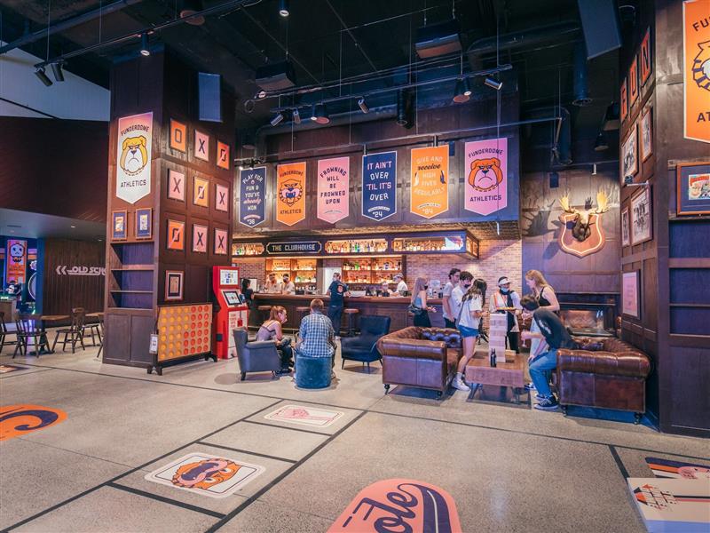 The Clubhouse diner & bar. People are playing giant jenga, while enjoying food and drinks.